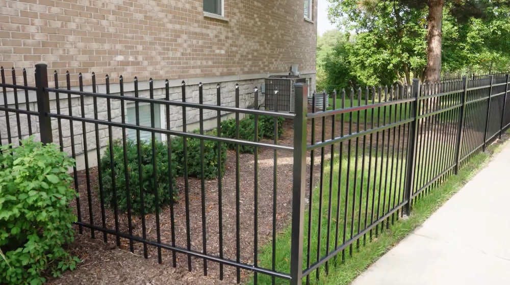 Black aluminum guard fence.