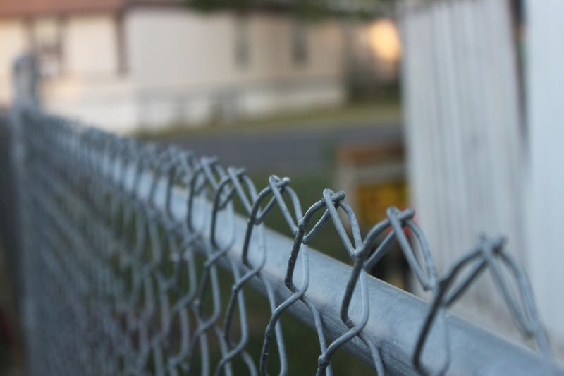 Chain link fence in a yard.
